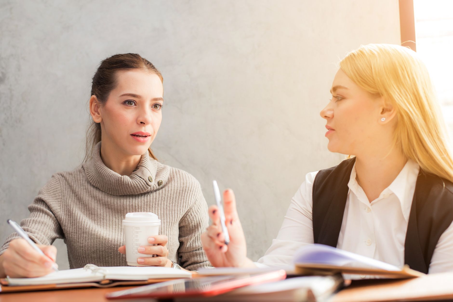 Two women in a thoughtful coaching conversation